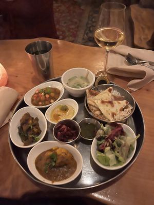 Green salad, mystic soup, channa, alo gobi, green beans, hummus, rice and roti to start!  at East is East - Main St in Vancouver
