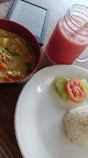 I didn't get any good overview shot, so here's 3 slightly-blurry images that might tell the story.

(Tofu+tempe curry plus watermelon juice) at Memoh Warung in Canggu