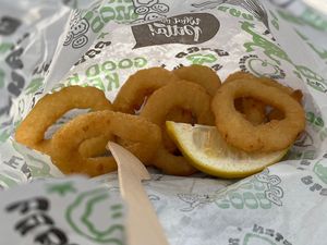 Friend onion rings with a splash of lemon. Can’t beat it    at What The Pitta in Croydon