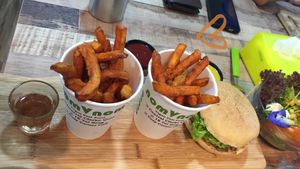 Two favorite menu items! Sweet potato fries and the king mushroom head burger at NomVnom - Tai Seng in Central Singapore