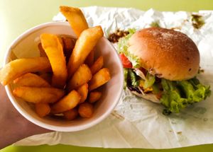Black peppered cowless burger with fries at NomVnom - Tai Seng in Central Singapore
