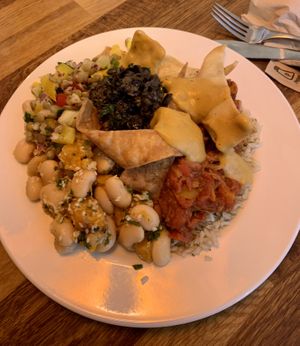 Jackfruit chilli with a lentil salad and butternut squash salad, topped with olive tapenade.  at Iydea in Brighton