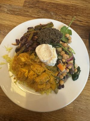Tofu curry, bean salad, chickpea salad, olive tapenade and vegan garlic aioli   at Iydea in Brighton