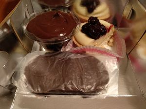 Profiterole (left), tart with patisserie and black cherry (right), walnut filled chocolate, aka "karioka" in greek (front) at Pasalidis in Thessaloniki