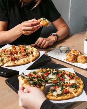 ultraviolet pizza, stranger wings pizza, and garlic knots at Virtuous Pie in Portland