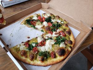 Superviolet pizza with kale, cashew moz, pine nuts, and pesto at Virtuous Pie in Portland