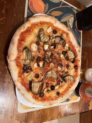 Organic (!) Pizza with vegan Mozzarella, artichokes, zucchini, nuts, herbs and basil   at Organic Pizza in Salzburg