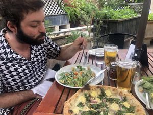Caesar salad and thunder kiss pizza at Donna Jean in San Diego