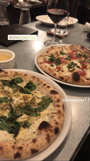 Pizza, crust dipping sauce, and wine! So good   at Donna Jean in San Diego