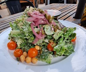 Salad Days: mixed greens, hemp seed miso dressing, apples, chickpeas, pickled onions, toasted pumpkin seeds, smoked date and black garlic puree (oil-free) at Donna Jean in San Diego