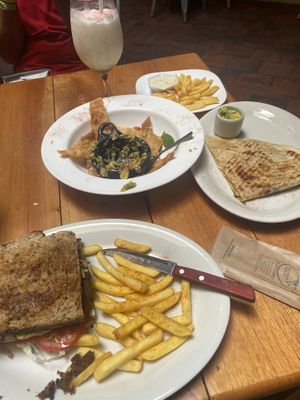 mushroom burger, chips and guac, chicken and cheese quesadilla. as you can see we at most of the chips  at Gringo Mike's in San Gil