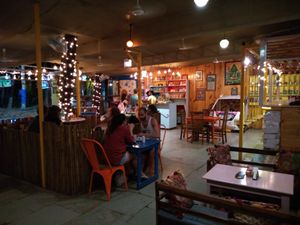 A view of the restaurant with the campervan and swings at Little World in Palolem