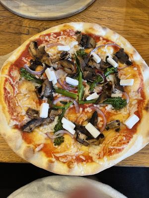 Not keen on the cold cheese chunks sprinkled on top but other a good pizza  at The Stable in Falmouth