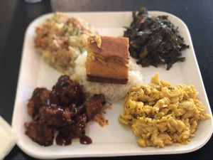 Popping BBQ with rice, potato salad, collars and Mac and cheese with a side of cornbread. Delicious  at Soul Good Vegan Cafe in Durham