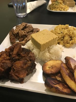 Jerk Chik’n, Mac n Cheeze, plantains, and candied yams with rice and corn bread.  at Soul Good Vegan Cafe in Durham