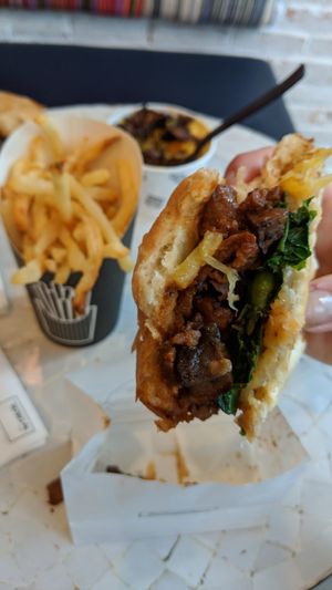 My messy BBQ burger, crappy fries, and mac & cheese. at By Chloe - Seaport Blvd in Boston