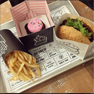 classic burger, GF cupcake, fries at By Chloe - Seaport Blvd in Boston