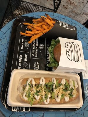 Sweet potato fries, original burger, and pesto meatball sub. SO GOOD.  at By Chloe - Seaport Blvd in Boston