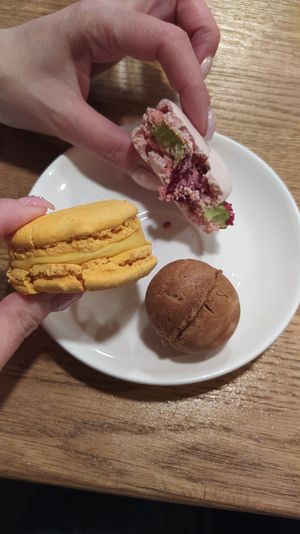 Exotic and raspberry-matcha macaroons, walnut-shaped cookie Horishok with vegan condensed milk. Half of macaroons already eaten so they are a little bit mashed))) at B12 Candy Bar - Maybe closed in Kyiv