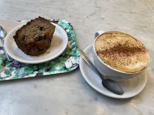 Banana bread and cappuccino   at Maisie Cafe in Paris