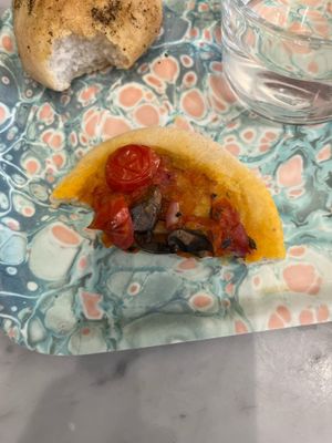 Half the mini pizza- better than it looks at Maisie Cafe in Paris