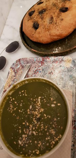 Spinach and chickpea soup (soup of the day) and olive focaccia at Maisie Cafe in Paris