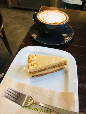Spiced carrot cake and Oatly cappuccino!  at The V & V Cafe in Glasgow