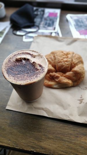 Cappuccino and croissant at The V & V Cafe in Glasgow