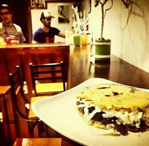 Venezuelan arepa fill with black beans and cheese at Wadaka Bites in Bogota