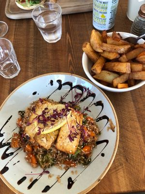 Tofu strir fry with rice and a rather large bowl of chips. at Bluebell Coffee UK in Swansea