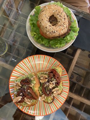 in alto il bagel, sotto l’avocado toast  at Grinder Coffee Lab in Ravenna