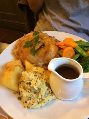 Mushroom and lentil wellington, served with seasonal veg, champ, roasties and vegan gravy. at The Castle Inn  in Skipton