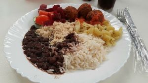 Eggplant balls, pasta and farofa at Vegecetera in Blumenau