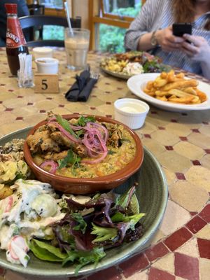 Vegan special of spinach, tomato and coconut dhal with a cavolo nero pakora with a side of three of the special salads and some of caban chips with vegan Mayo  at Caffi Caban Cafe in Brynrefail