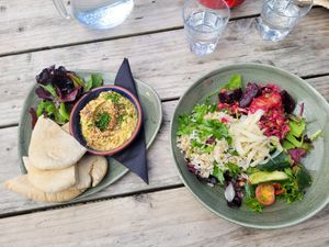 Hummus with pitta (left) & vegan salad bowl at Caffi Caban Cafe in Brynrefail