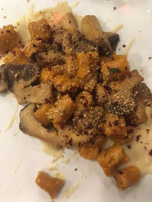 Pumpkin gnocchi with fava bean cream and mushrooms at Cardamomo Cucina Vegana in Arona
