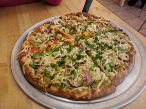 half achari veggie half eggplant masala with vegan cheese sub at Pizzawala's in Canton