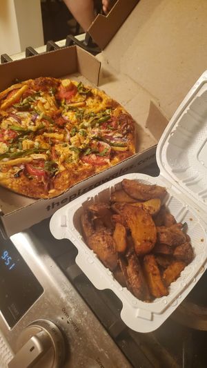 Achari Veg Pizza made vegan & Masala fries at Pizzawala's in Canton