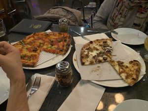 the vegan mushroom onion pizza (right) was incredible. simply incredible.   at Stoked Wood Fired Pizza in Brookline