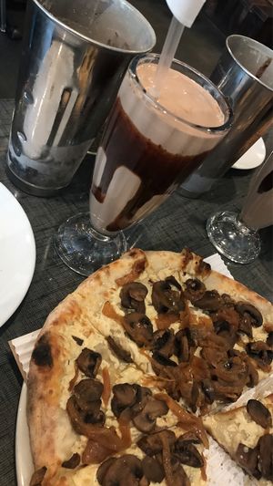 I got the FoMu ice cream milkshake and the mushroom and caramelized onion pizza, it was amazing!! at Stoked Wood Fired Pizza in Brookline