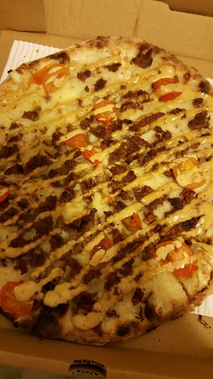 Impossible burger pizza with violife cheese at Stoked Wood Fired Pizza in Brookline