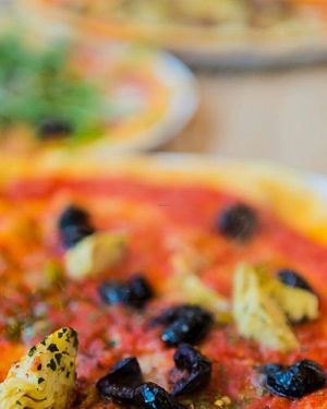 Pizza with olives and artichokes  at Pizzeria Bellini in Duisburg