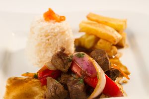 Our traditional Lomo Saltado made with fresh seitan, wok sautéed onions, tomato wedges, peppers,french fries and side of rice. at Sabor Peruano in Santa Fe