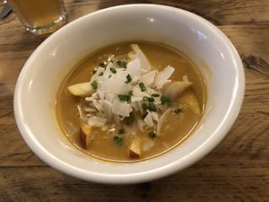 Sweet potato soup with coconut flakes and apples. Tasted very good.  at SIGGIS v/gan dine & co. in Munich