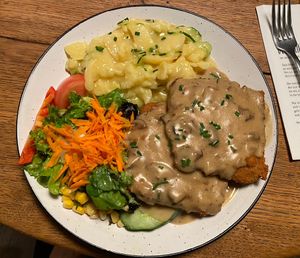 Jägerschnitzel with mushroom sauce and potatoe salad  at SIGGIS v/gan dine & co. in Munich