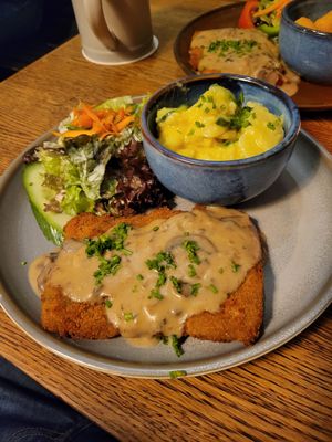 Schnitzel with mushroom sauce and Kartoffelsalat at SIGGIS v/gan dine & co. in Munich