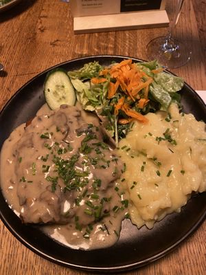 Schnitzel with potato salad   at SIGGIS v/gan dine & co. in Munich