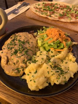 Schnitzel with potato salad   at SIGGIS v/gan dine & co. in Munich