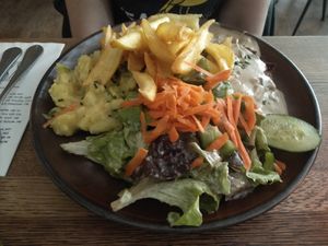Schnitzel with potato salad and fries. at SIGGIS v/gan dine & co. in Munich
