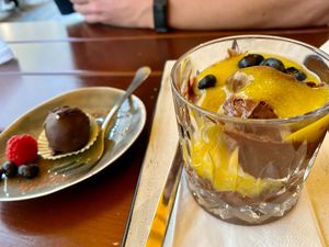 chocolate truffle ball and passion fruit chocolate mousse at SIGGIS v/gan dine & co. in Munich